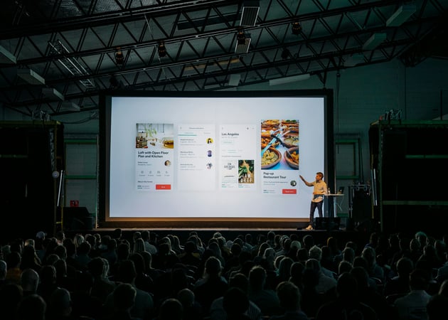 Man presenting to crowd