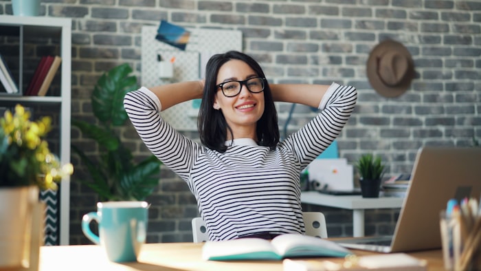 Happy woman on desk