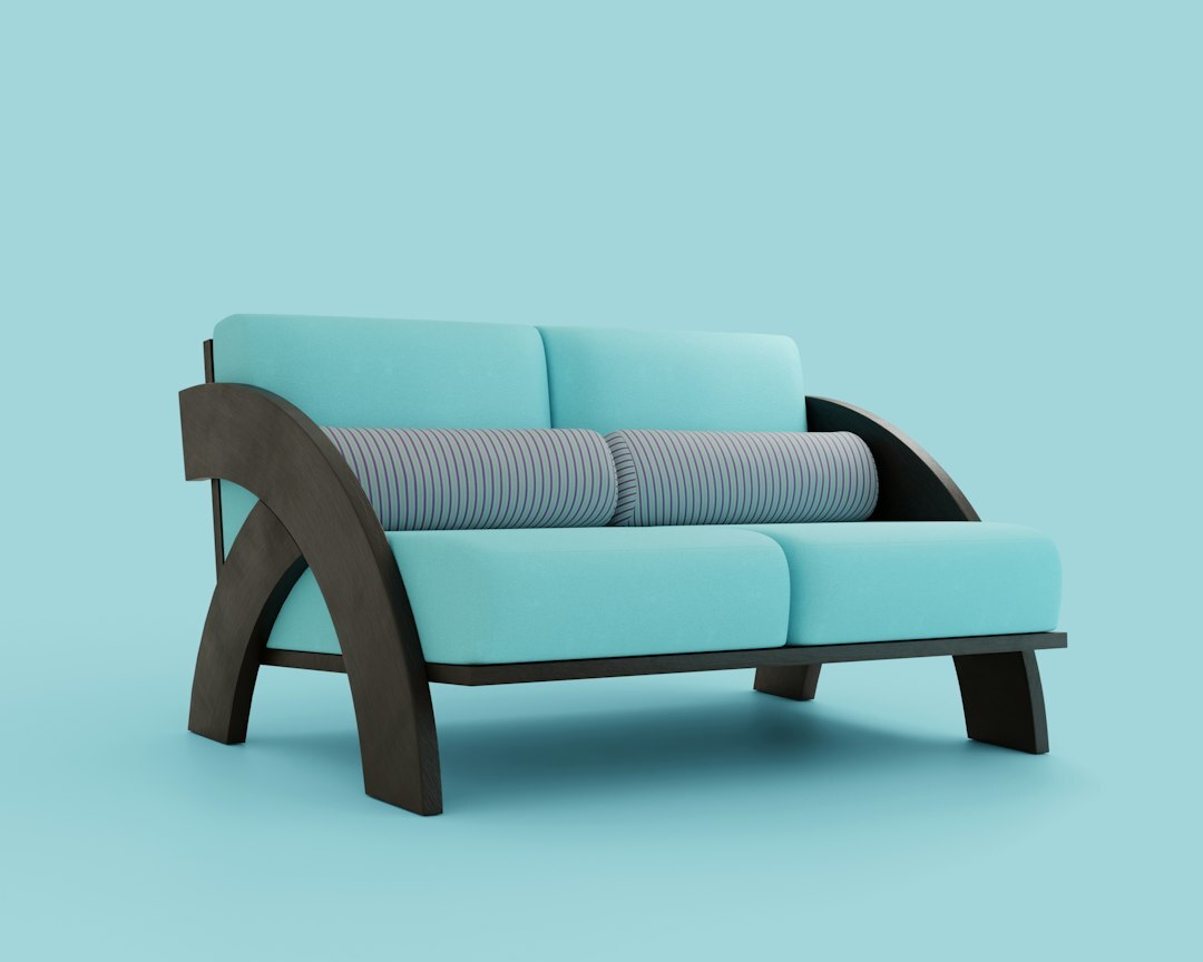 Teal sofa with dark wooden frame